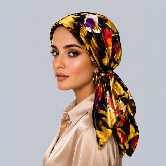 Model wearing the Midnight Gold Bouquet dark floral silk headscarf with rich red and purple flowers on a black base